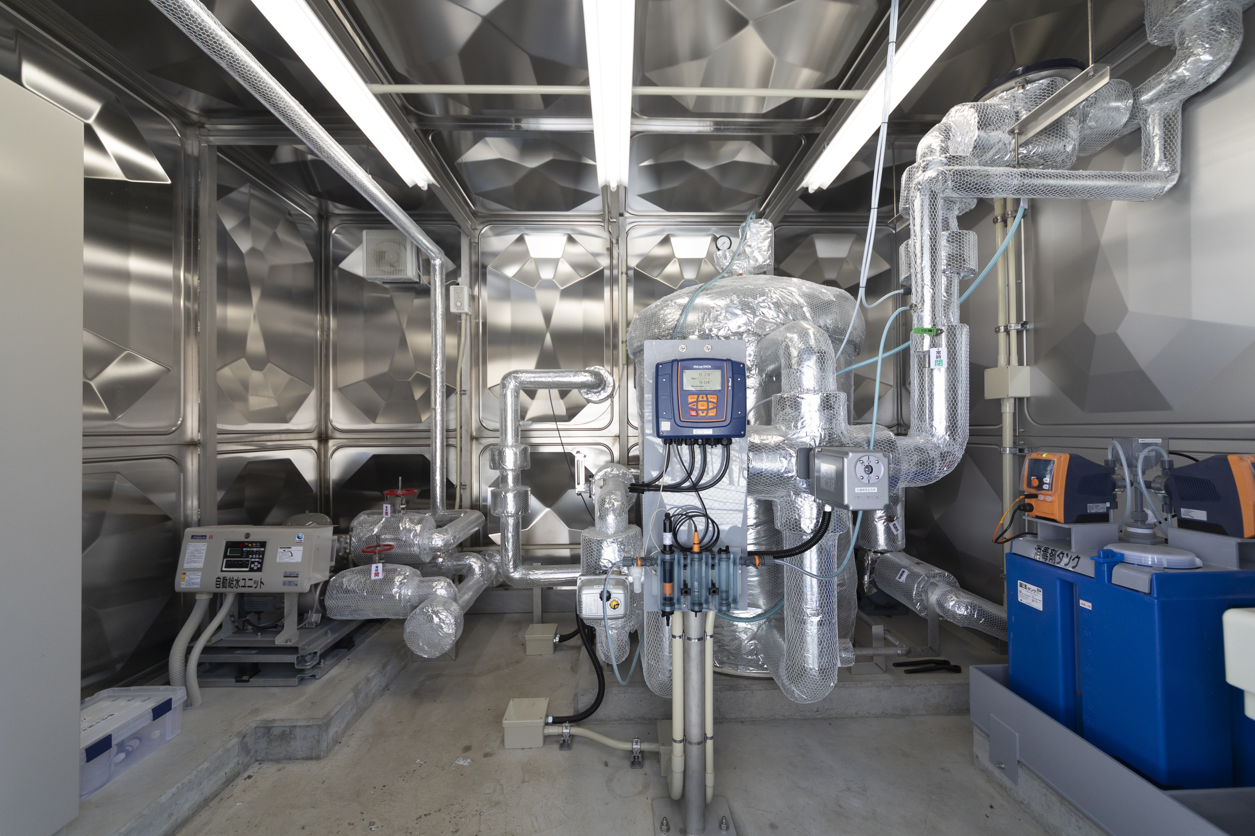 Well water treatment facility (filter [middle], dosing system [right])